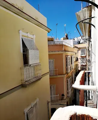 a view of an alley from a building at La Casita del Arte in Cádiz