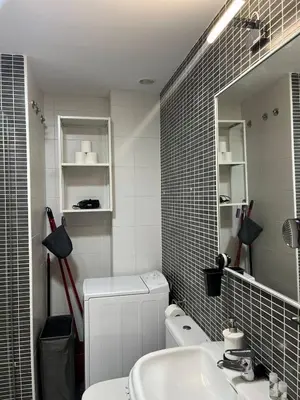 a bathroom with a sink and a toilet and a mirror at Colón Corazón de Cádiz con Ascensor Grupo AC Gestion in Cádiz