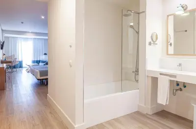 a bathroom with a shower and a sink at Playa de la Luz in Rota