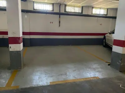 an empty garage with a car parked in it at Villa palacio Playa y piscina Grupo AC Gestion in Cádiz