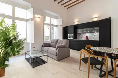 a living room with a couch and a table at Allo Apartments San Roque 2ºA in Cádiz