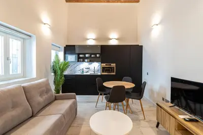 a living room with a couch and a table at Allo Apartments San Roque 2ºC in Cádiz