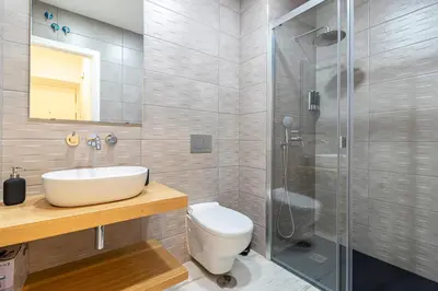 a bathroom with a toilet and a sink and a shower at Allo Apartments San Roque 2ºC in Cádiz