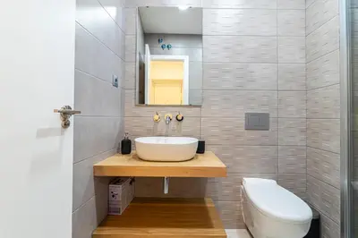 a bathroom with a sink and a toilet at Allo Apartments San Roque 2ºC in Cádiz