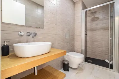 a bathroom with a sink and a toilet at Allo Apartments San Roque 3ºA in Cádiz