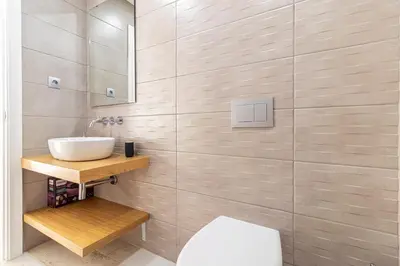 a bathroom with a sink and a mirror at Allo Apartments San Roque 3ºA in Cádiz
