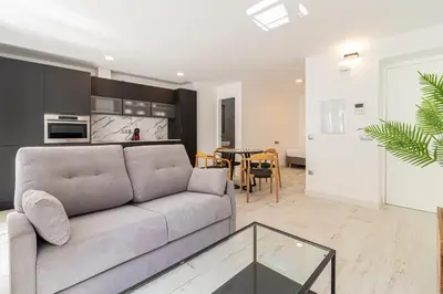 a living room with a couch and a table at Allo Apartments San Roque 3ºA in Cádiz
