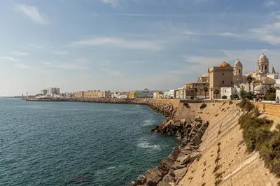 a view of the ocean and buildings on the shore at Allo Apartments San Roque 3ºB in Cádiz