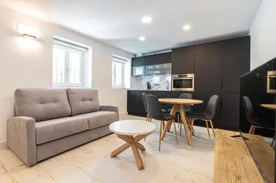 a living room with a couch and a table at Allo Apartments San Roque 3ºC in Cádiz