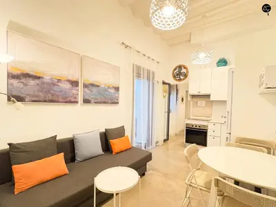 a living room with a couch and a table at Casita del Mentidero Grupo AC Gestion in Cádiz