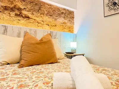 a bedroom with a large bed with at Casita del Mentidero Grupo AC Gestion in Cádiz