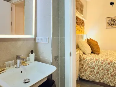 a bathroom with a sink and a bed at Casita del Mentidero Grupo AC Gestion in Cádiz