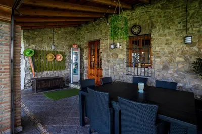 a dining room with a table and chairs at CASA DAGO in Chiclana de la Frontera