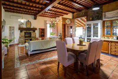 a living room with a table and a couch at CASA DAGO in Chiclana de la Frontera