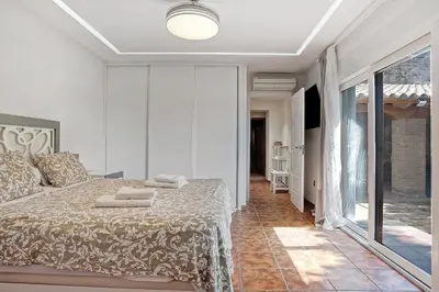 a bedroom with a bed with towels on it at CASA DAGO in Chiclana de la Frontera