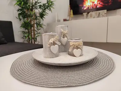 a table with three candles with hearts on it at Apartamento Catamarán in El Puerto de Santa María
