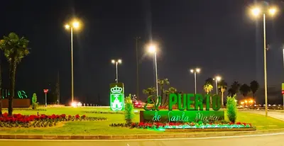 a sign in the middle of a park at night at Apartamento Catamarán in El Puerto de Santa María