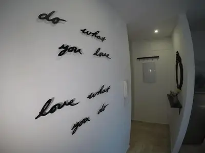 a wall with writing on a wall in a room at Precioso apartamento a 700 m del mar in Chiclana de la Frontera