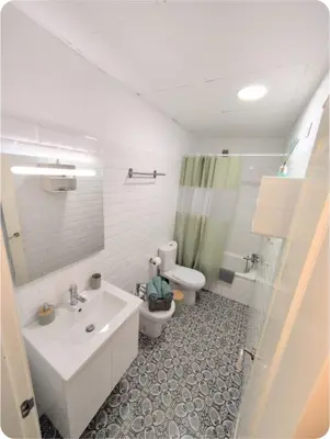 a bathroom with a sink and a toilet and a shower at Puerto Luxury Centro in El Puerto de Santa María