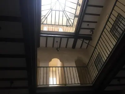 an overhead view of a building with a glass ceiling at Puerto Luxury Centro in El Puerto de Santa María