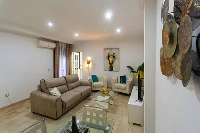 a living room with a couch and a table at SH Piluca's Home. Moderno apartamento con patio in Cádiz