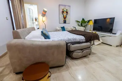 a living room with a couch and a television at SH Piluca's Home. Moderno apartamento con patio in Cádiz