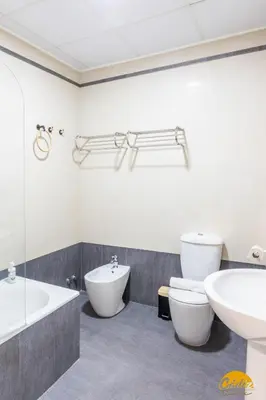 a bathroom with a tub and a toilet and a sink at Balcones del Atlantico - FREE PARKING by Cadiz Time in Cádiz