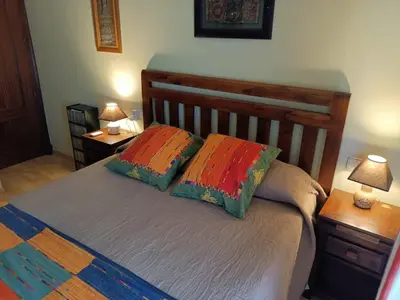 a bedroom with a bed with two pillows on it at Apartamento la Concha in Chiclana de la Frontera