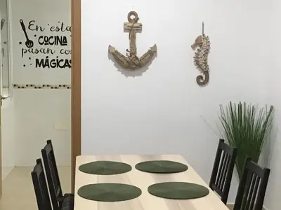 a room with two chairs and a table at La Casa Morada in Cádiz