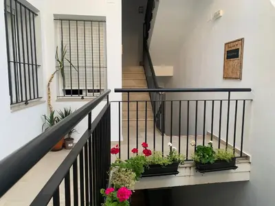 a dining room with a table with chairs and an anchor at La Casa Morada in Cádiz