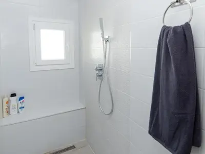 a bathroom with a sink and a shower at GuestReady - Blanca Paloma Ana in El Puerto de Santa María