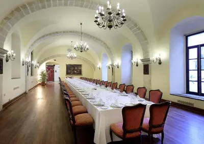 a large room with a long table and chairs at Crisol Monasterio de San Miguel in El Puerto de Santa María