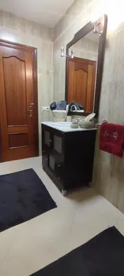 a bathroom with a sink and a mirror at casa de vicky in El Puerto de Santa María
