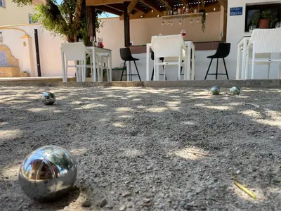 a soccer ball on the ground with chairs in the background at casa de vicky in El Puerto de Santa María