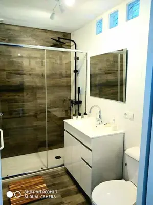 a bathroom with a shower and a toilet and a sink at P Casa con Azotea privada y Céntrica. WiFi+Netflix in El Puerto de Santa María