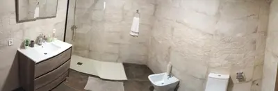 a bathroom with a sink and a toilet at Precioso bajo muy grande a 200 metros de playa in Chipiona