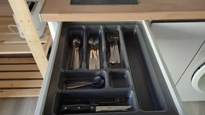 a drawer in a kitchen with utensils in it at Apartamento la Buganvilla in Jerez de la Frontera