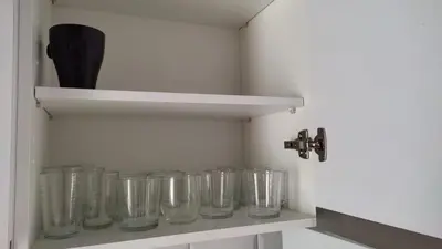 a row of glass mason jars sitting on a shelf at Apartamento la Buganvilla in Jerez de la Frontera