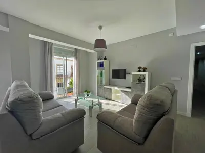 a living room with two couches and a tv at Apartamento La Catedral - Ole Solutions in Jerez de la Frontera