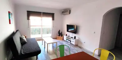 a living room with a couch and a table at Apartamento Plaza Toros in El Puerto de Santa María