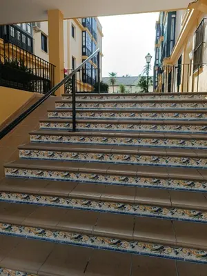 a set of stairs in a building at Piso Calzada de la Infanta Tres Carabelas Sanlúcar de Barrameda in Sanlúcar de Barrameda