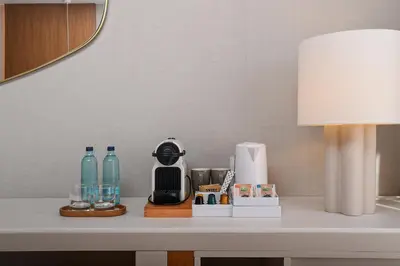 a table with a lamp and some bottles on it at Valentin Sancti Petri in Chiclana de la Frontera