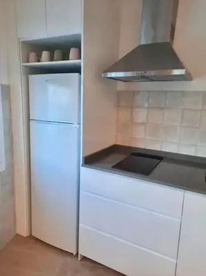 a kitchen with a white refrigerator and a stove at El rincón de Manolita. #2 in Bornos
