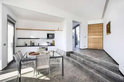 a kitchen and dining room with a table and chairs at Retiros Los Agustinos in Arcos de la Frontera