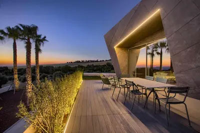 a wooden deck with a table and chairs on a house at Retiros Los Agustinos in Arcos de la Frontera