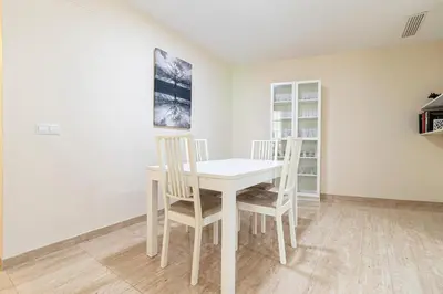 a white table and chairs in a room at Allo Apartments Consistorio Centro 2 Habitaciones in Jerez de la Frontera