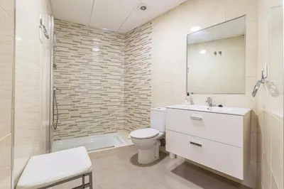 a bathroom with a toilet and a sink and a shower at Allo Apartments Consistorio Centro 2 Habitaciones in Jerez de la Frontera