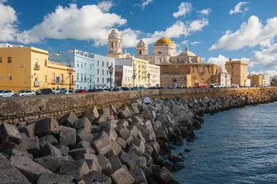 a group of buildings next to a body of water at Crisol Chiclana in Chiclana de la Frontera