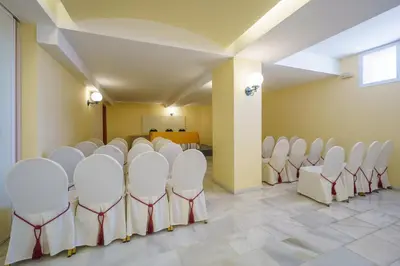 a room with a bunch of chairs in it at Crisol Chiclana in Chiclana de la Frontera