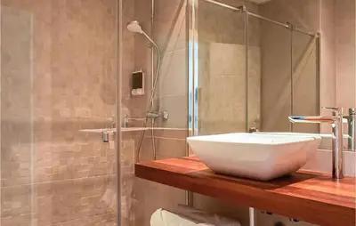 a bathroom with a sink and a shower at Gorgeous Apartment In Chipiona in Chipiona